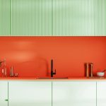 Kitchen interior in bright colours, black tap and sink, green  and orange cabinets, kitchen tools, 3d rendering